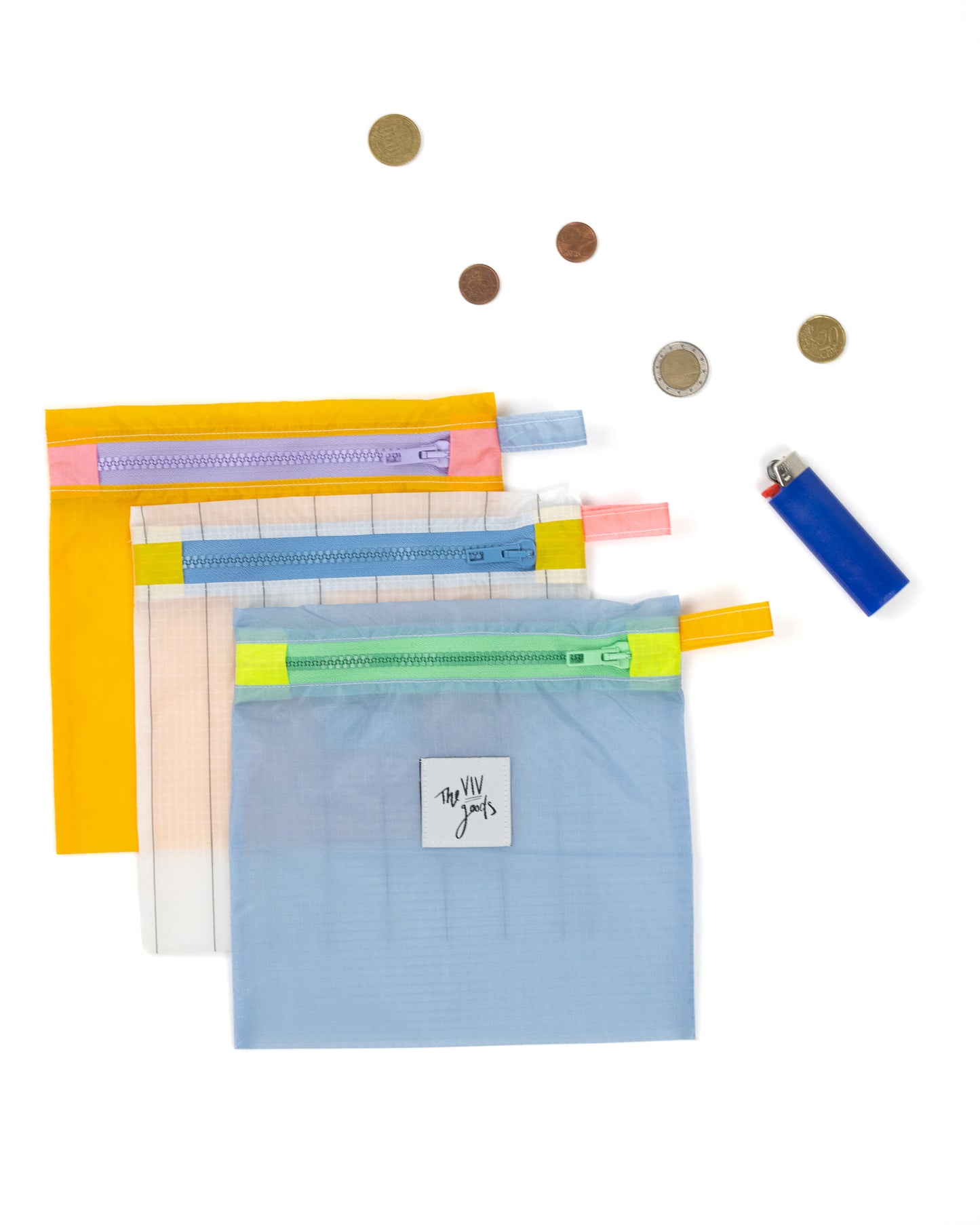 colored square zipper pouch with lavender zipper. made from upcycled ripstop nylon
