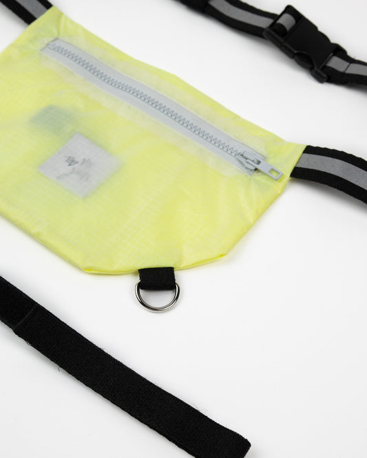 Running bag for athletes flat lay in neon yellow with black straps