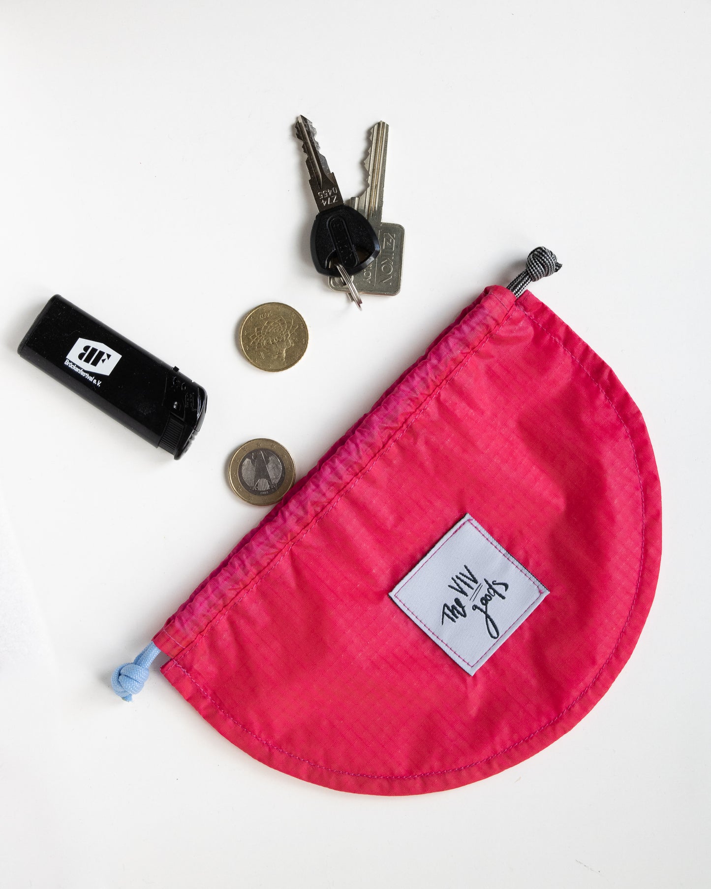 set of two draw string pouches made from rip stop nylon in light and dark pink