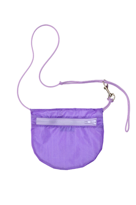 Flat lay crossbody bag in lavender made from recycled rip stop nylon