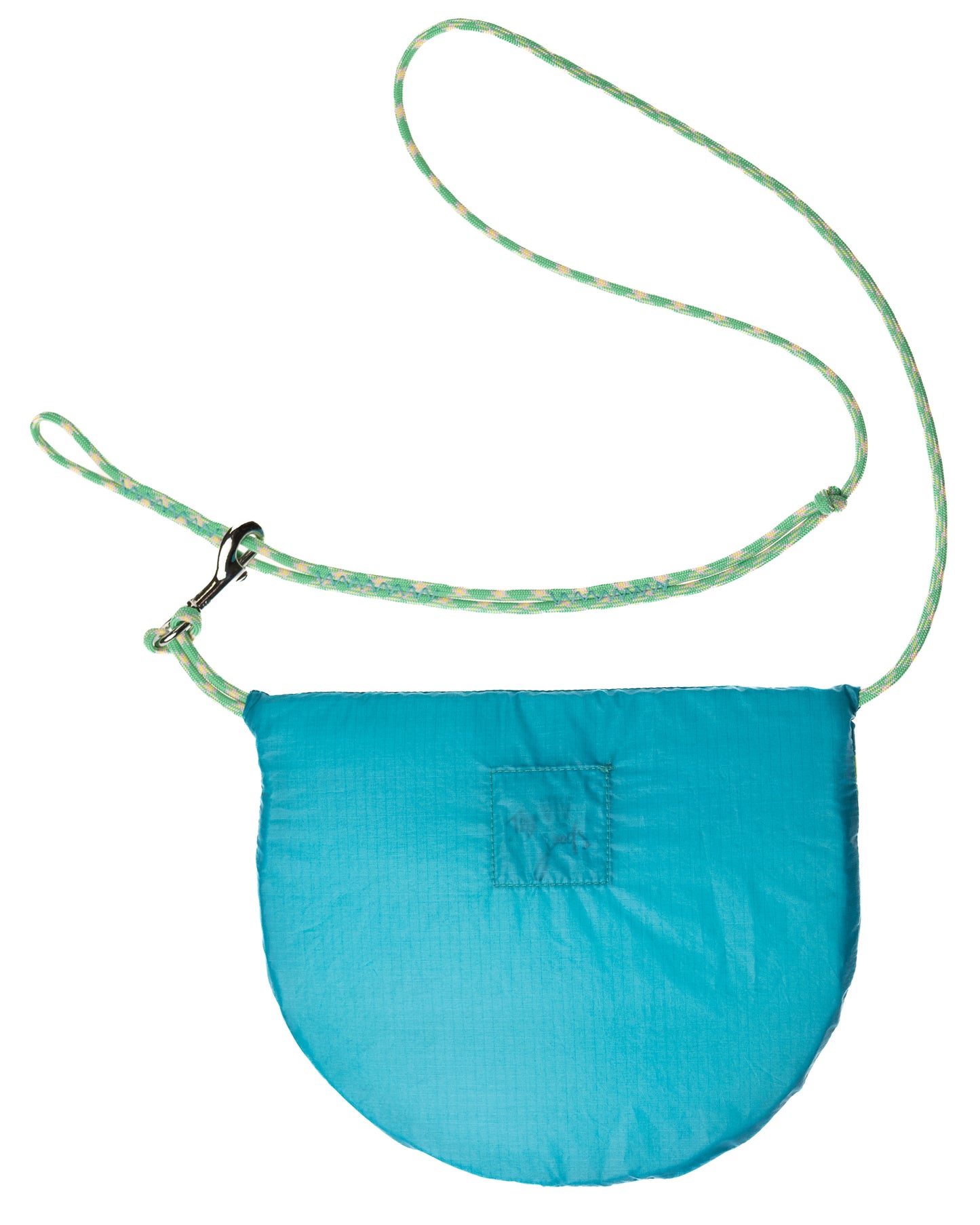 flat lay crossbody bag in turquoise and green made from recycled rip stop nylon