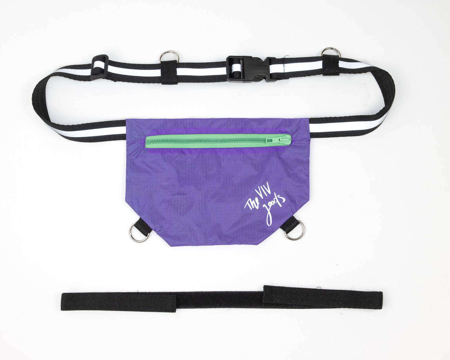 flat lay of the SPORT.BAG designed for runners in purple with a reflective strap and light green zipper