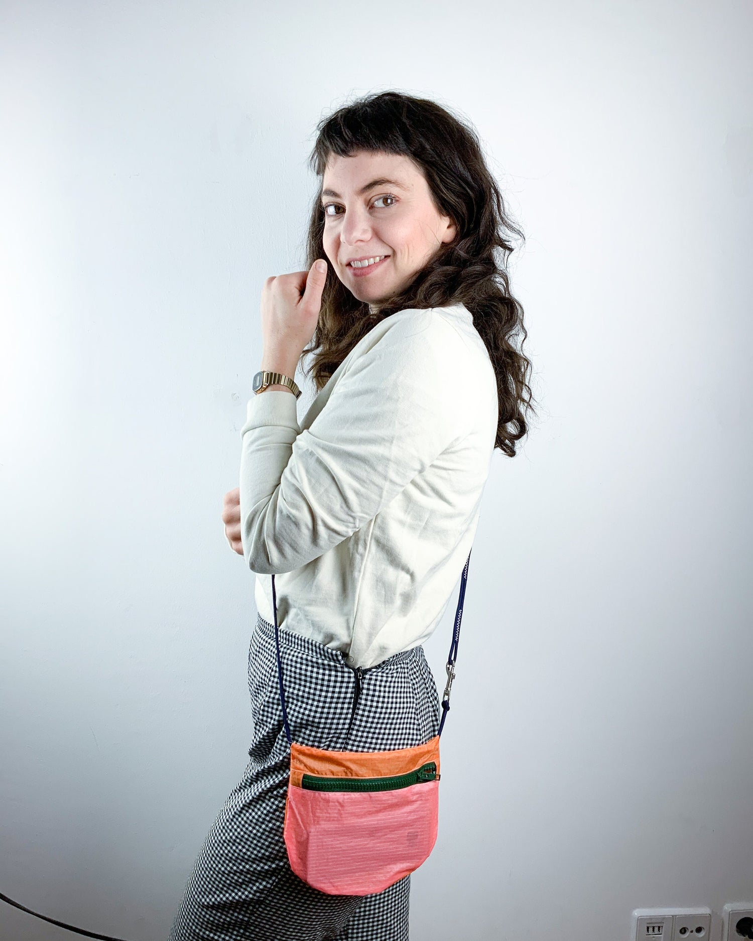 Model showing how to wear the U.BAG strap extension