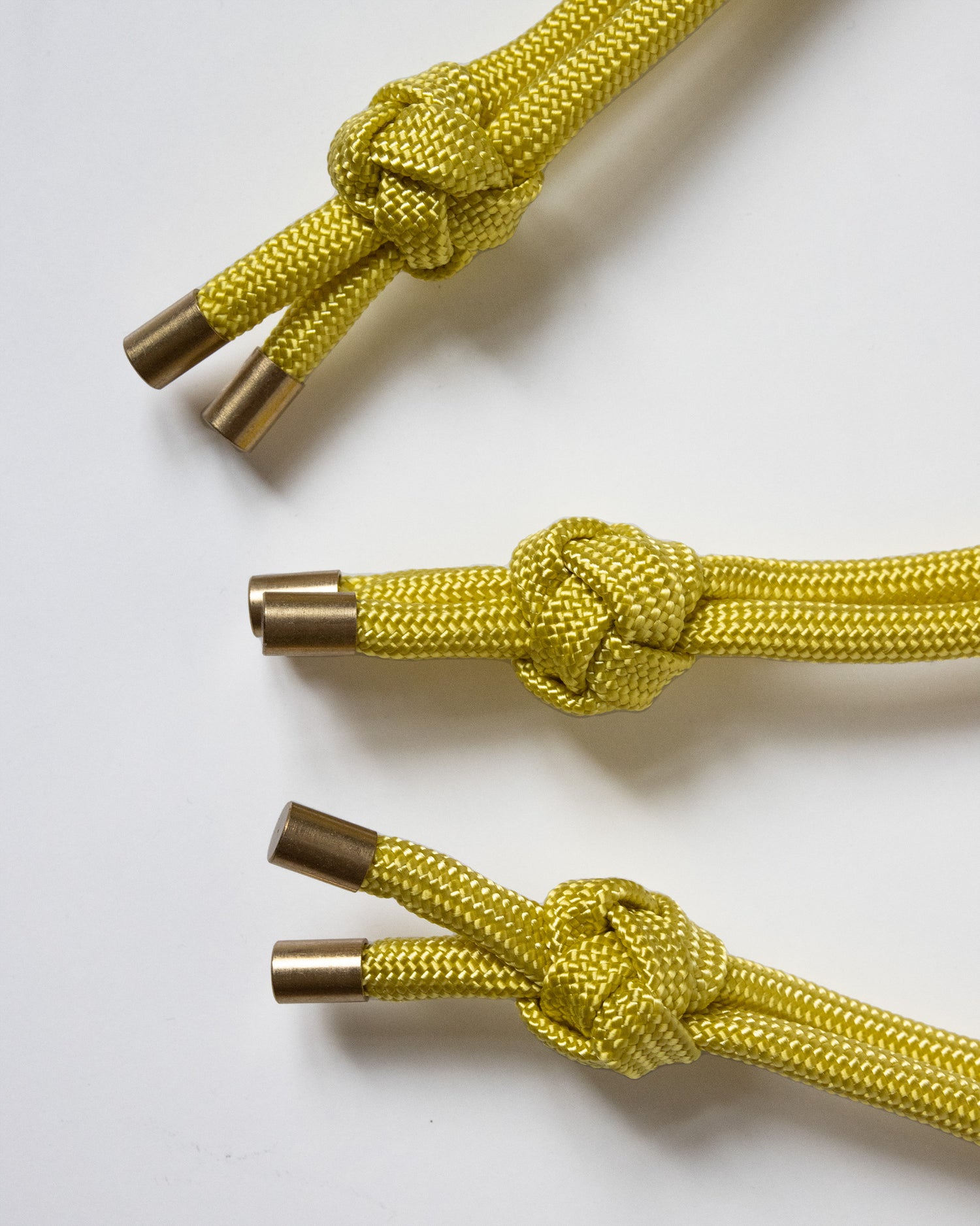 hand knotted recycled rope keychain with brass finishings in corn yellow