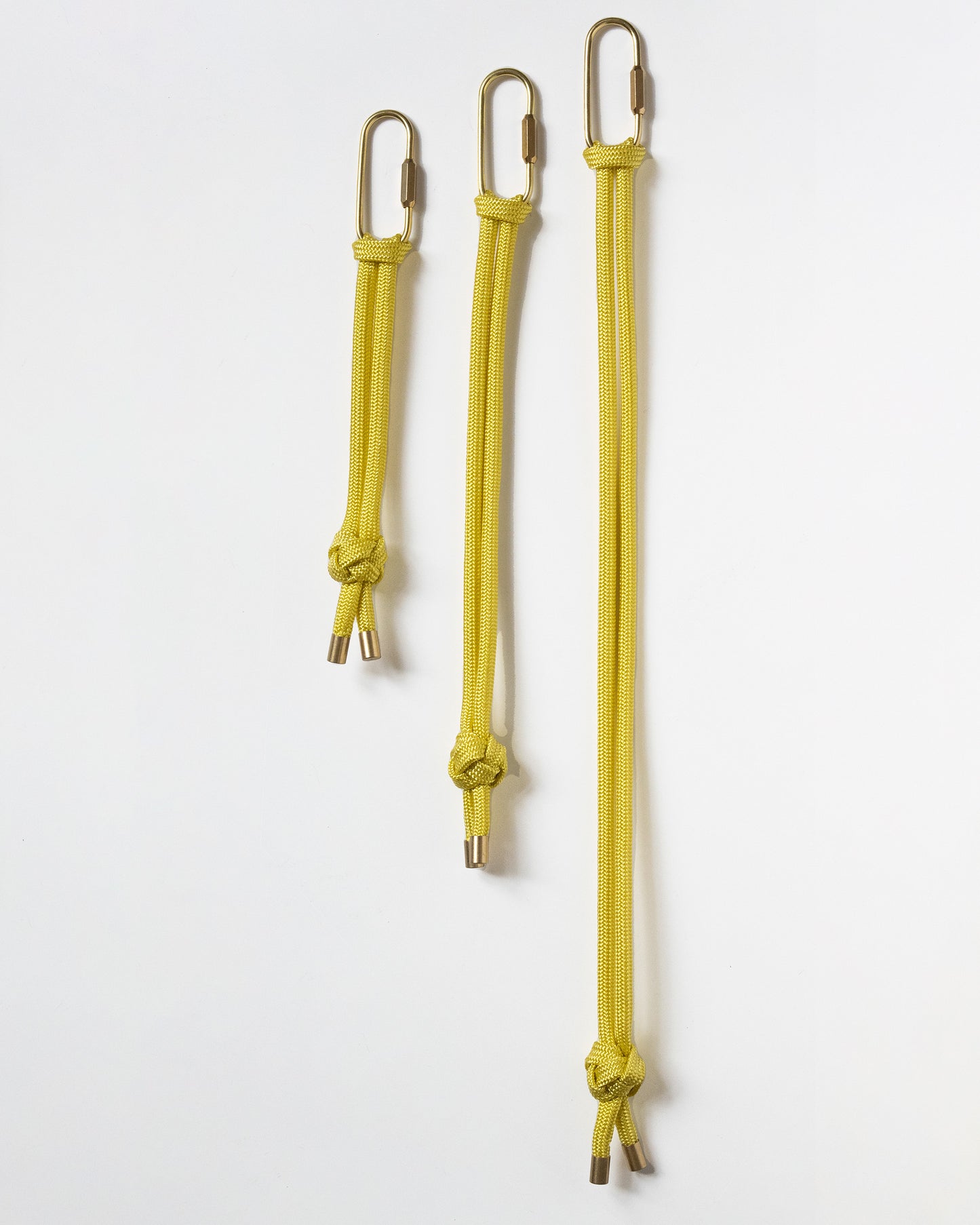 hand knotted recycled rope keychain with brass finishings and carabiner in corn yellow
